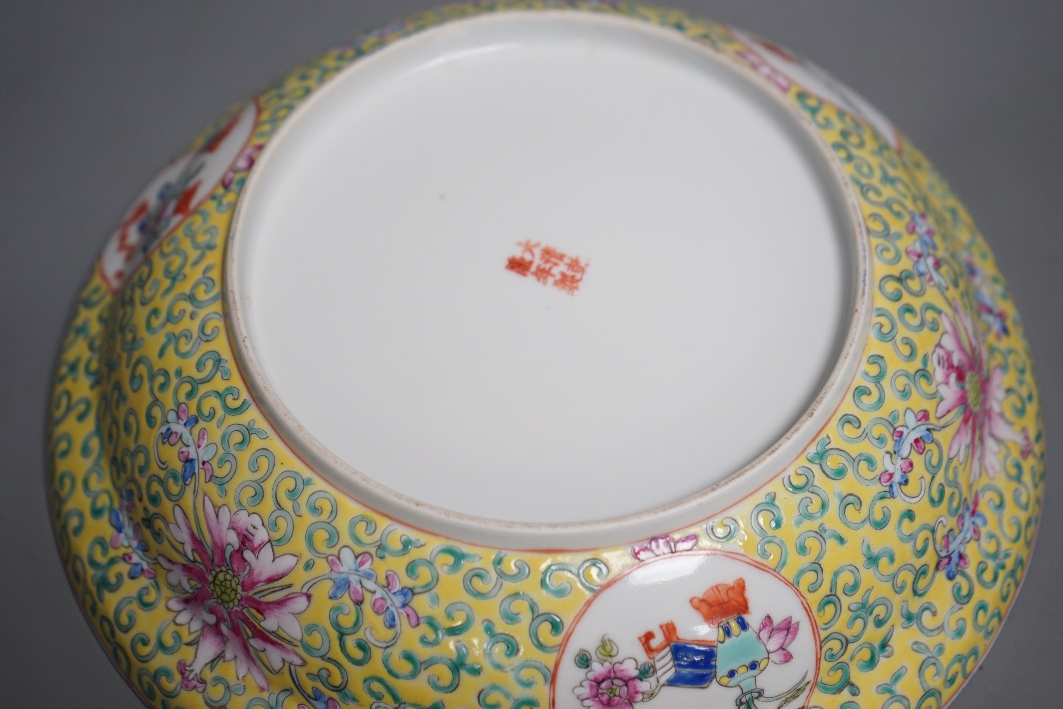 A large Chinese famille rose yellow ground bowl and cover, Republic period, 25cm diameter